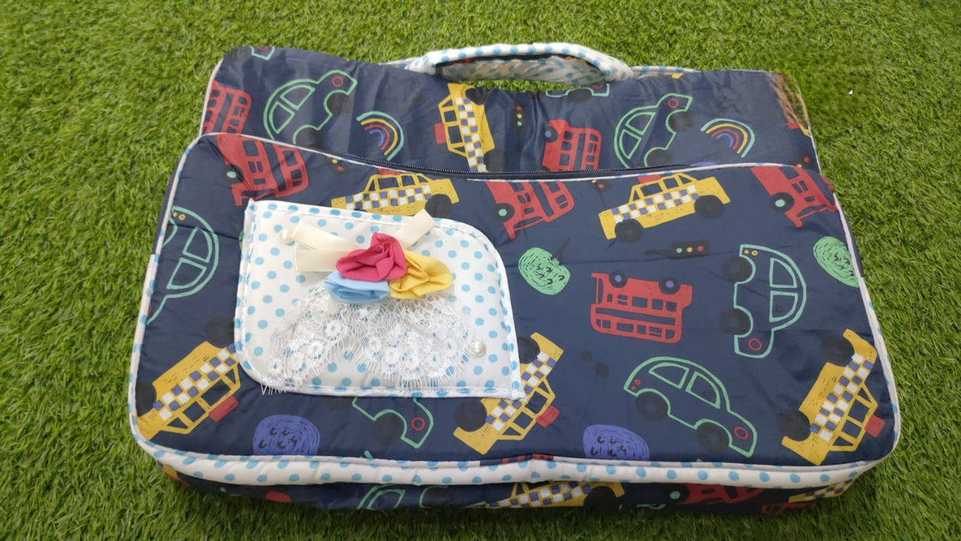 A navy blue quilted baby carrier bag